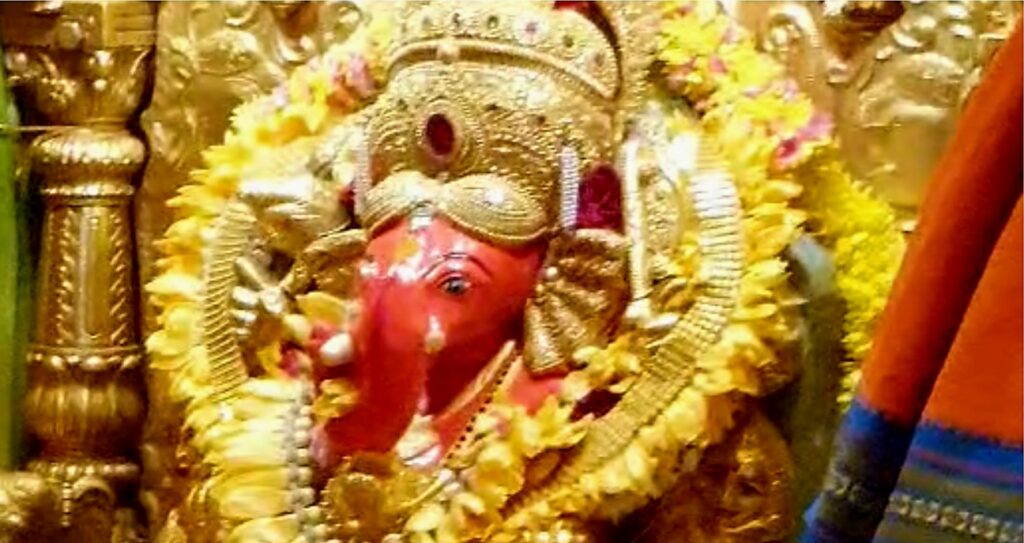 A color photo of beautifully decorated lord Ganesh at Siddhivinayak Temple.